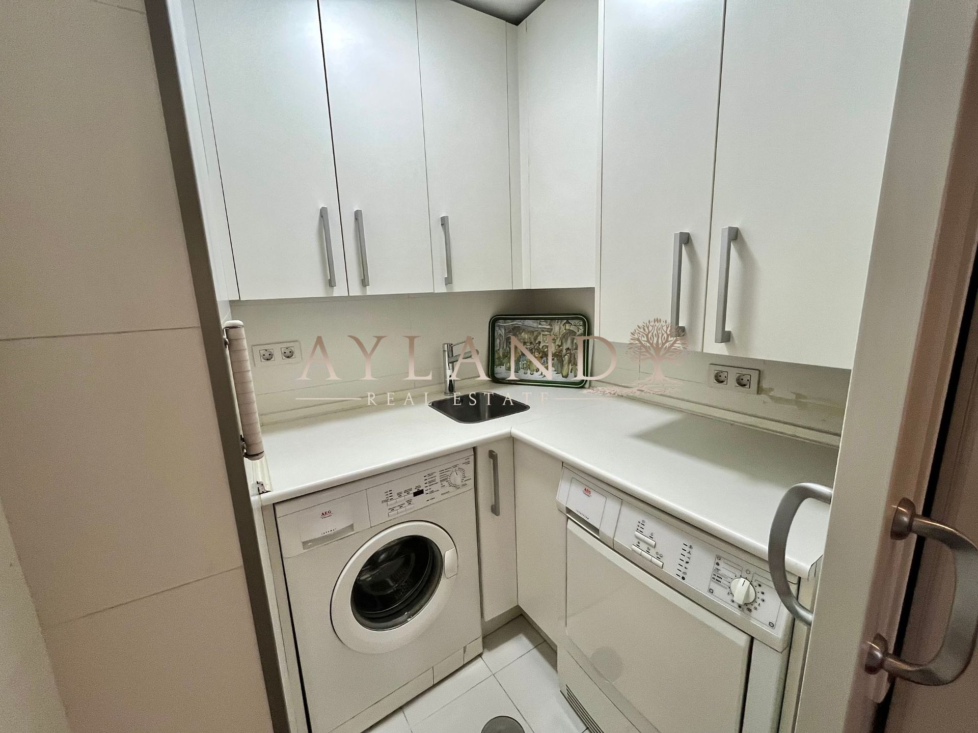 La zona de lavado, integrada en la cocina